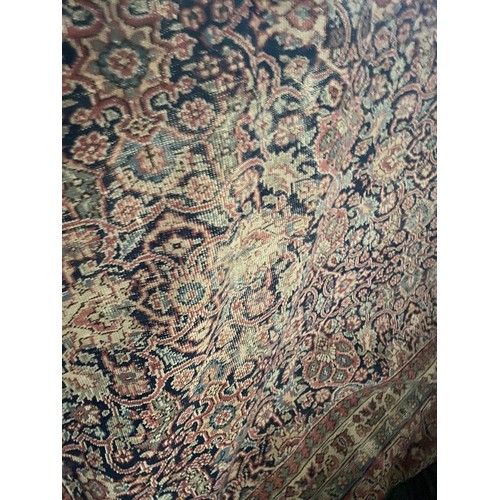 112 - Burgundy and blue ground Persian rug 390 x 325cm (worn - sold as seen)