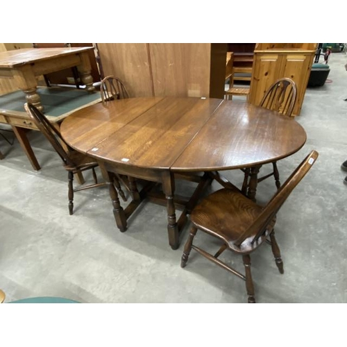 211 - Good quality oak gate leg table 73H 122W 60-180D and 4 chairs