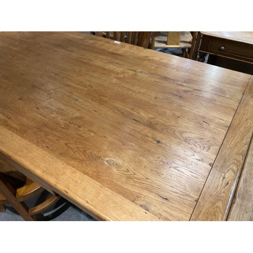 135 - Good quality oak extending dining table 79H 168-260W 91D and 6 Raft Langley teak chairs