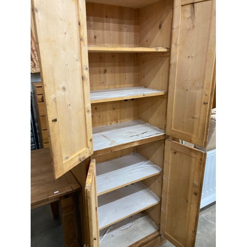 32 - Pine 4 door cupboard with shelves to the interior 196H 68W 44D