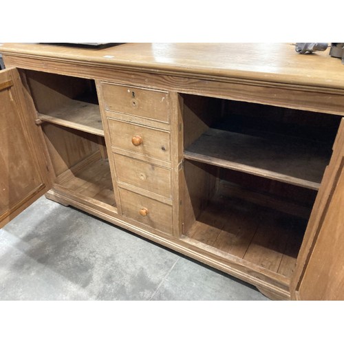 104 - English pine dresser base with two doors and four drawers 83H 158W 55D