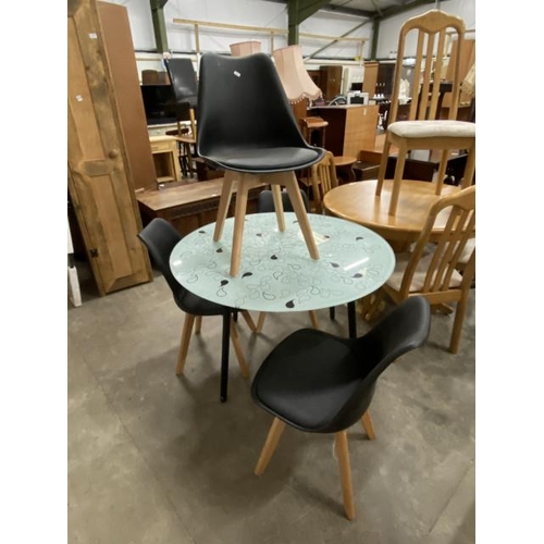 134 - Ikea 'Salmi' contemporary kitchen table 73H 105cm diameter and 4 black chairs