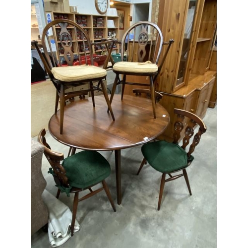 173 - Ercol elm drop leaf table 71H 113W 60-124D and 6 chairs including 2 carvers