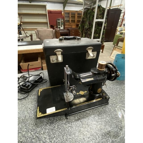 234 - Cased Singer 221-1 featherweight sewing machine with foot pedal/mains lead & sewing requisites (Unte... 