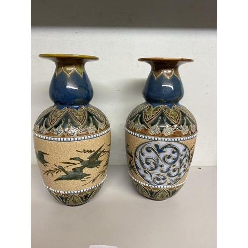 261 - Pair of Doulton Lambeth pottery vases by Florence Barlow both decorated with pate-sur-pate birds in ... 