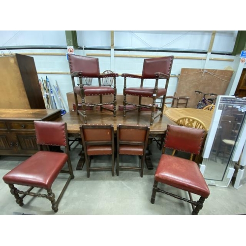 29 - Oak draw leaf table 76H 183-273W 92D and 10 oak and leather dining chairs including 2 carvers