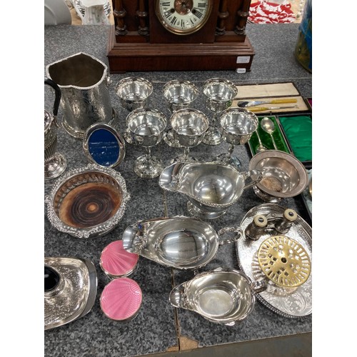 220 - Good collection of silver plate inc. candelabra, sauce boats, ladle, dishes, ice bucket, champagne b... 