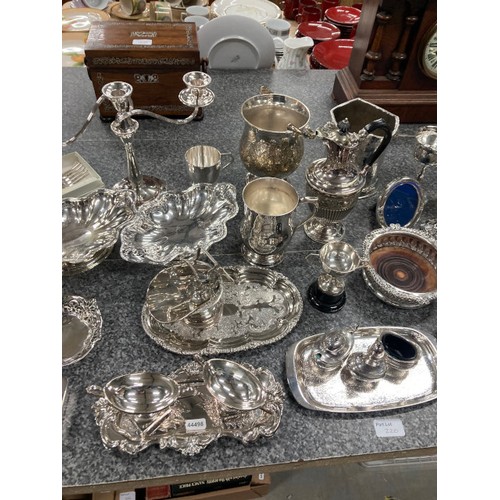 220 - Good collection of silver plate inc. candelabra, sauce boats, ladle, dishes, ice bucket, champagne b... 