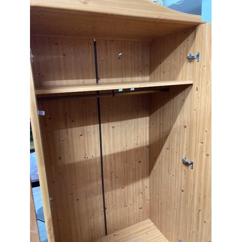 101 - Pine effect wardrobe with hanging rail and one shelf to the interior 183H 97W 54D