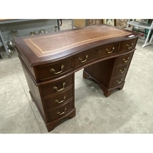 176 - Mahogany serpentine pedestal desk with brown leather inset and one key 81H 120W 59D (in 3 sections)