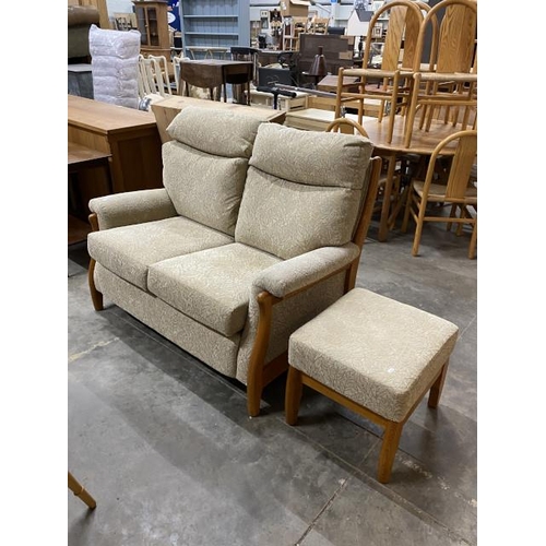 69 - Two seater settee 130W and a matching footstool 43H 50W 46D