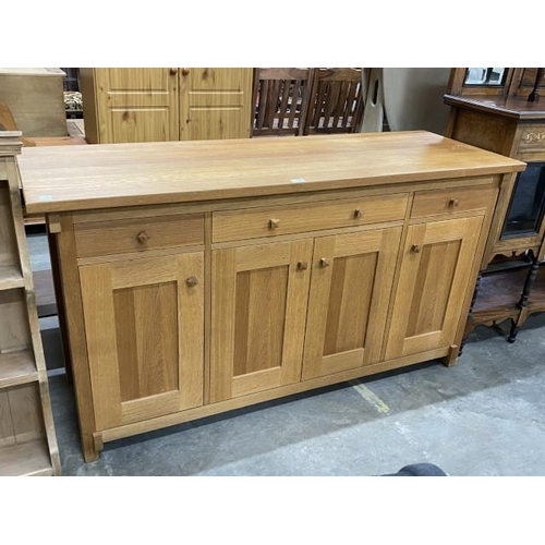 71 - Good quality oak sideboard with four doors and four drawers 85H 160W 55D