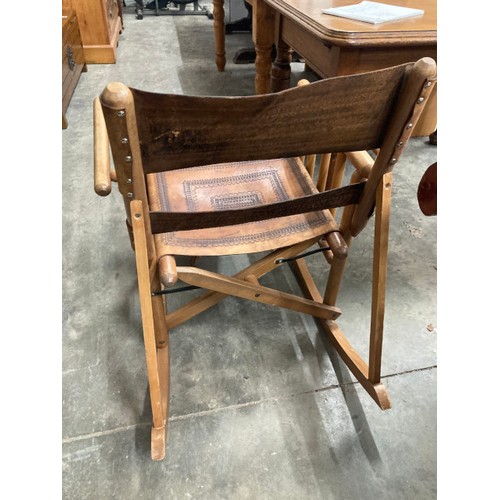 16 - Costa Rican Campaign style folding beech and leather rocking chair 84H 65W 83D and a matching stool ... 