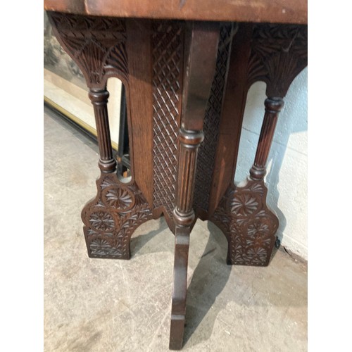 115 - Early 20th century carved lamp table in the manner of Liberty's 59H 48W 48D