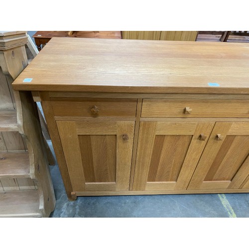 71 - Good quality oak sideboard with four doors and four drawers 85H 160W 55D