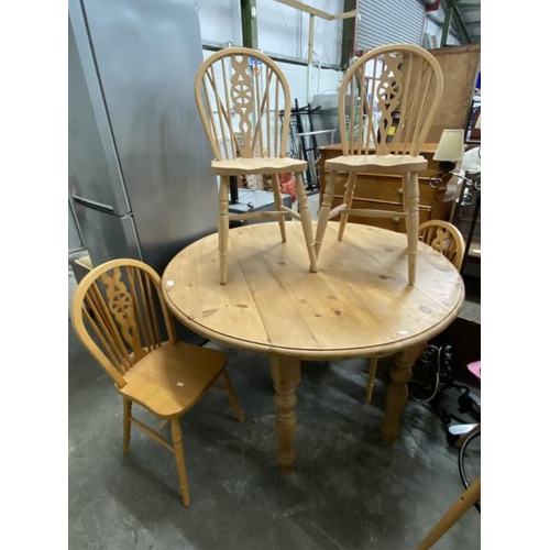 17 - Pine drop leaf table 78H 137W 64-137D and 4 pine wheel back chairs