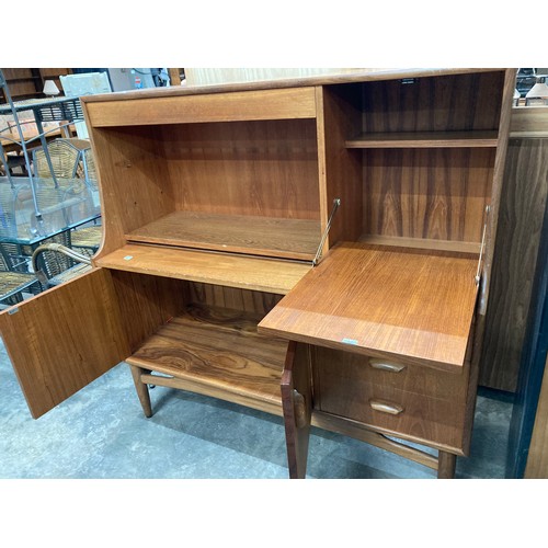 100 - Mid century teak G Plan cocktail cabinet 122H 124W 47D (requires shelf supports)