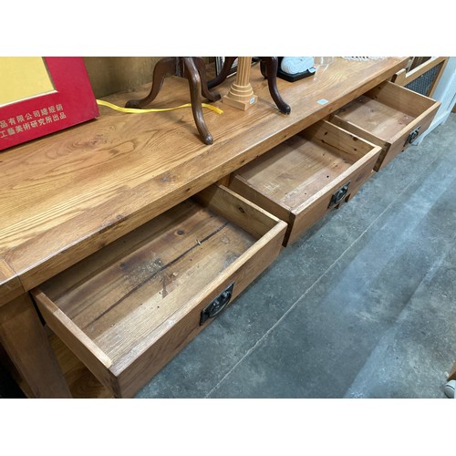 120 - Good quality oak sideboard with three drawers and wine rack 83H 181W 46D