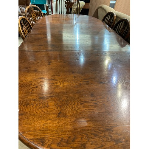 154 - Good quality oak extending dining table with two leaves 75H 167-257W 105D and 8 chairs including 2 W... 