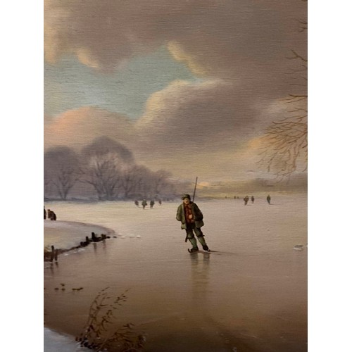 343 - Gilt framed oil painting on board depicting a winter landscape with figures ice skating on a frozen ... 