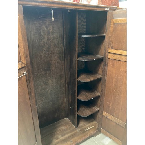 42 - Good quality carved oak two door wardrobe with shelves and a hanging rail to the interior 168H 104W ... 