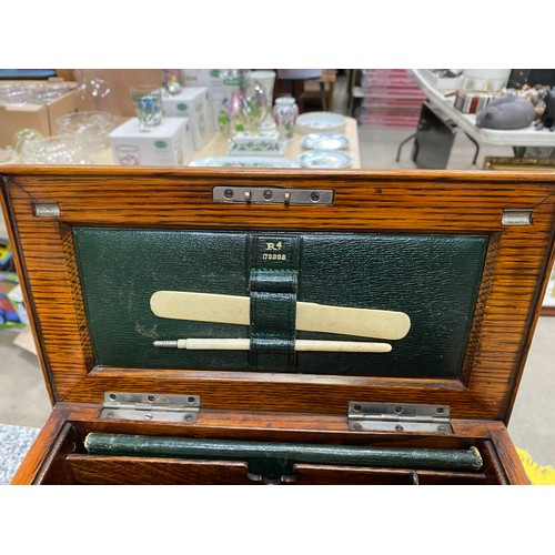 297 - Edwardian oak portable office/ writing box with silver mount inscribed 'Presented to Arthur T. Smith... 