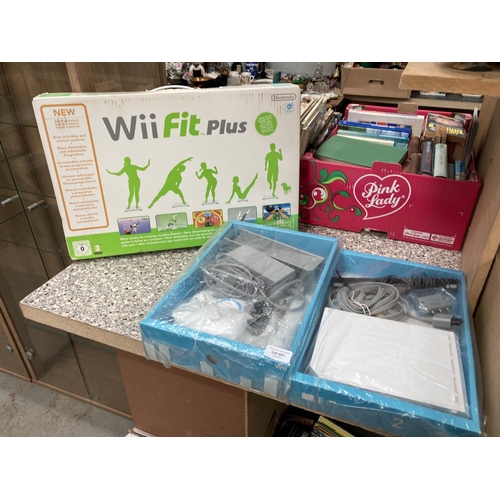 451 - Boxed Nintendo Wii fit Plus with 2 boxes of accessories, controls, power supply etc