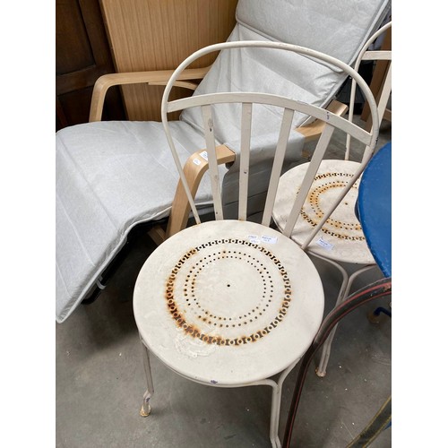 103 - French metal garden table 73H 60cm diameter, 4 chairs and hosepipe with reel