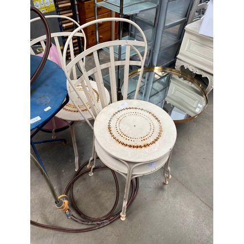 103 - French metal garden table 73H 60cm diameter, 4 chairs and hosepipe with reel