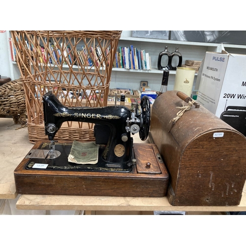 Cased Singer electric sewing machine Y2317319 with instruction booklet, power lead and foot pedal