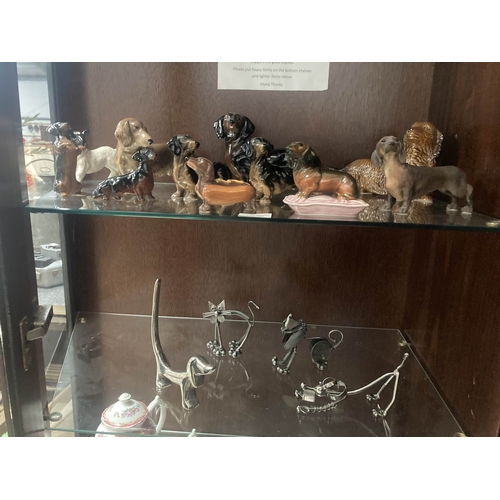 2 shelves of mainly Dog themed ornaments inc.  Dachshunds