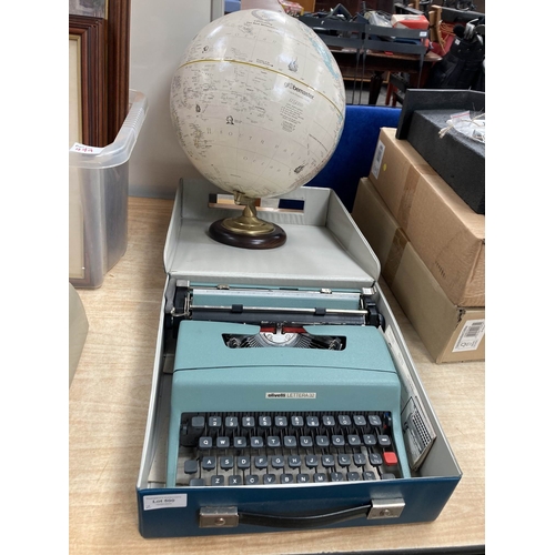 Cased Olivetti Lettera 32 portable typewriter and a Globemaster 12" globe