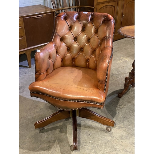 125 - Chesterfield button back swivel office chair in Bruciato colour leather, purchased from Smiths The R... 