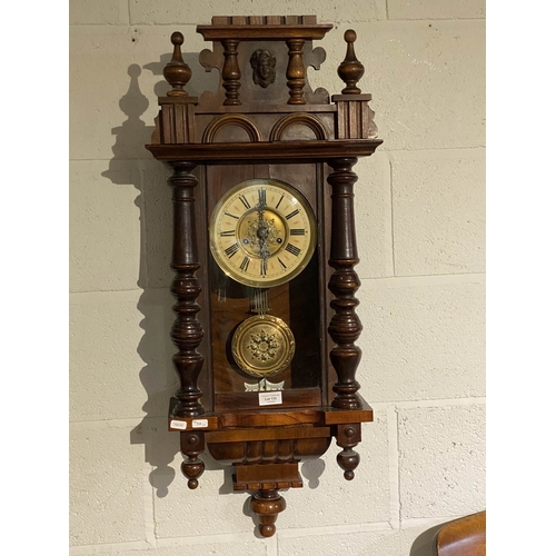 133 - Victorian carved walnut Vienna clock with pendulum & key 93H 38W 17D (Missing top finial)