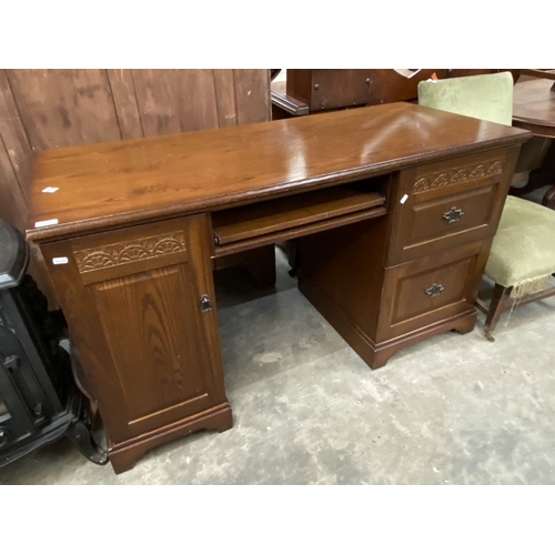 147 - Oak kneehole desk with carved detail 80H 140W 60D