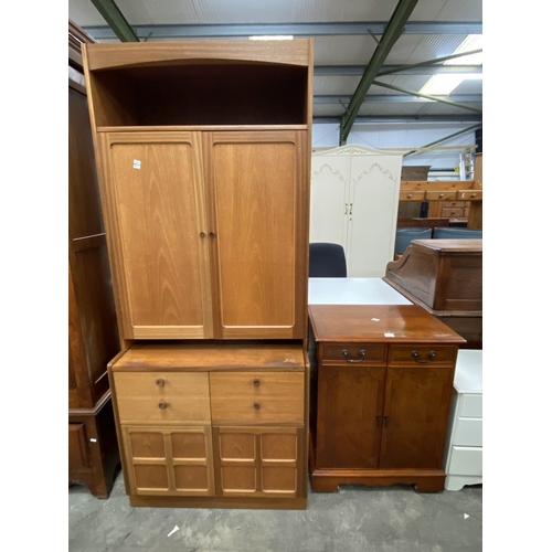 157 - Yew wood two door cupboard 82H 64W 45D & a mid century Parker Knoll teak work station 194H 83W 62D