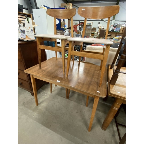 167 - Mid century Formica topped table 76H 106W 71D with 4 chairs