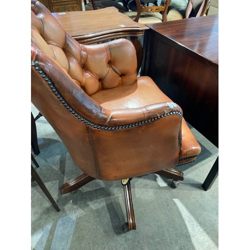 125 - Chesterfield button back swivel office chair in Bruciato colour leather, purchased from Smiths The R... 