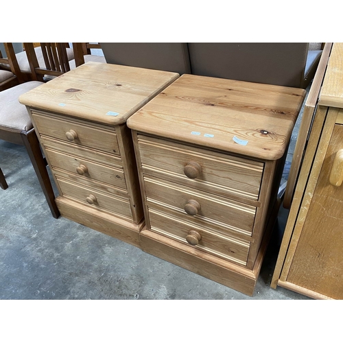 141 - Pair of pine three drawer bedside chests 61H 46W 42D