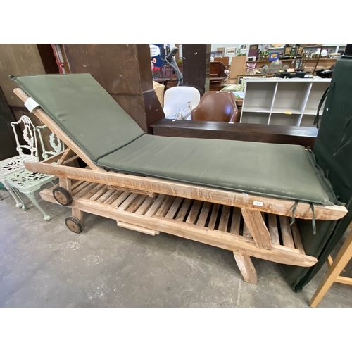 145 - 2 teak sun loungers with cushions 67H 100W 65D