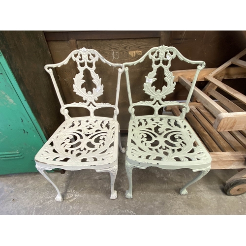 146 - 2 cast garden chairs 83H x 49W