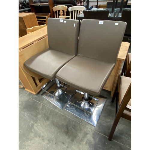 149 - 2 chrome based swivel, rise and recline bar stools 93H 40W