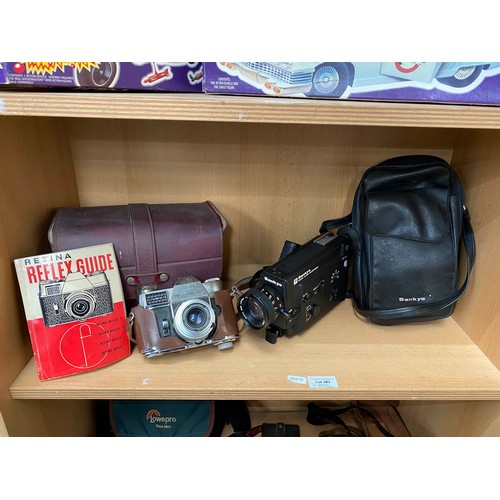 283 - Three shelves of vintage camera and video cameras including Kodak Retina Reflex III with guide, Sank... 