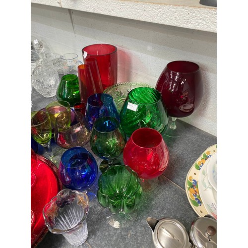 328 - Assorted coloured glass including cannisters, decanter