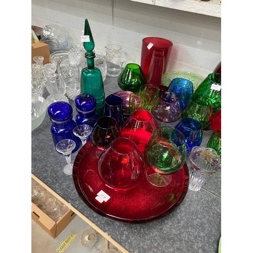 328 - Assorted coloured glass including cannisters, decanter