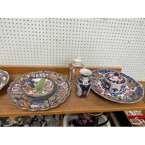 337 - Shelf of oriental tableware's including peacock plates, tea cups etc