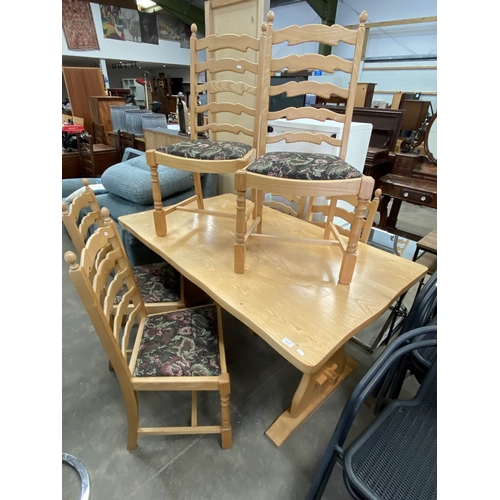 101 - Pale oak refectory table 74H 152W 91D and 6 ladder back chairs