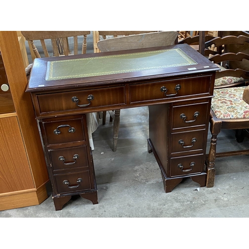 84 - Mahogany pedestal desk with green leather inset 75H 91W 46D