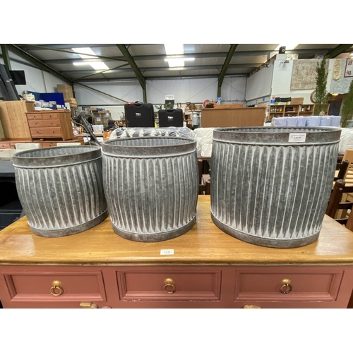 87 - 3 graduated galvanised planters  36H 34W 32D (NEW)