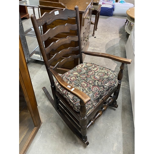 176 - Oak ladder back rocking chair 92H 59W